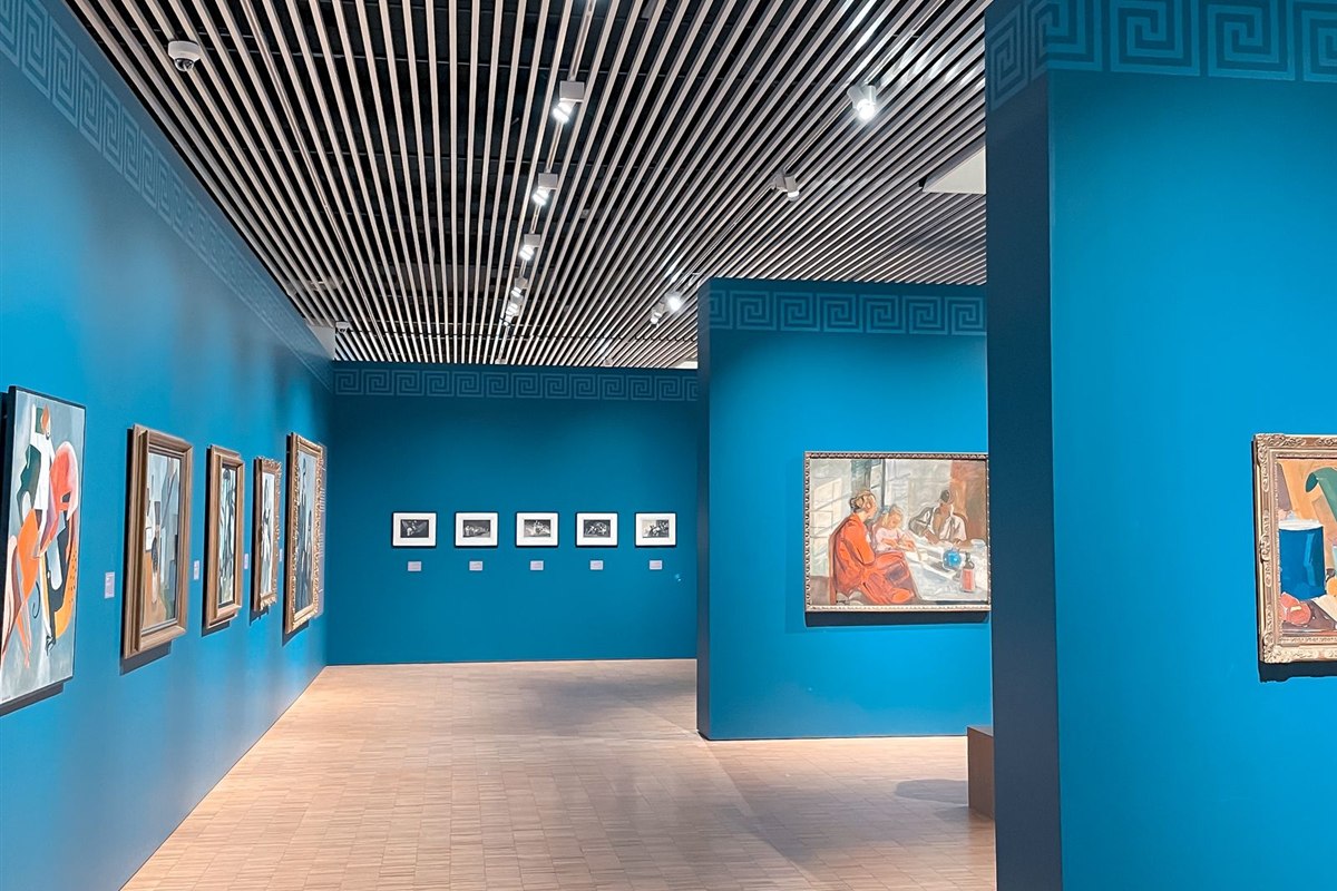 Modern art gallery interior with vibrant blue walls